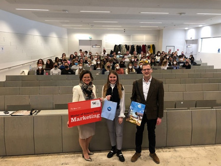 P&G visits Retailing and Sales Class; Three people stand infront of the marketing class