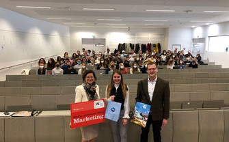 P&G visits Retailing and Sales Class; Three people stand infront of the marketing class