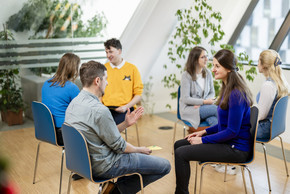 Maria facilitating a peer group