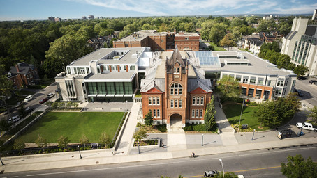 In this picture, we see campus building of Queen's University.