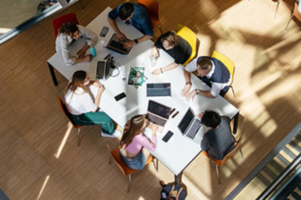 Some students sitting around a table