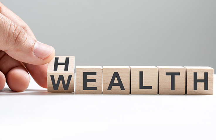 Würfel mit der Aufschrift Health/Wealth