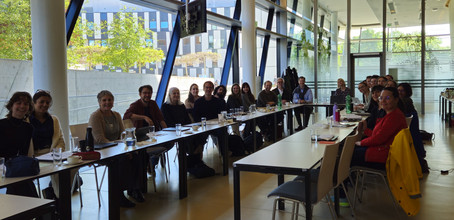 People sitting around a U-shaped table