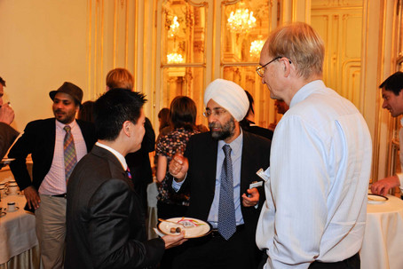 Coffee Break (Andrew Ang discussing with Raman Uppal and Antti Ilmanen, from left)