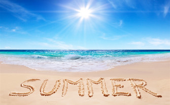 the beach with letters spelling out SUMMER in the sand