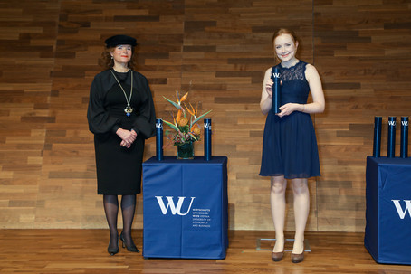 Academic Director PD Dr. Christina Holweg congratulates a graduate of the eighth cohort