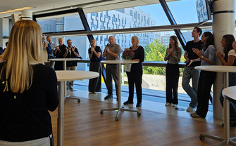Members of the department of management in a circle