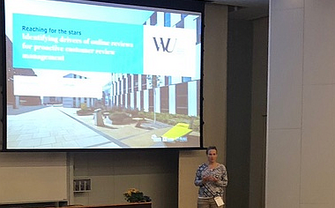 [Translate to English:] Nadine Schröder presents what drives customers to engage in online reviews