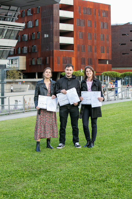 The tree finalists with their certificates and price money