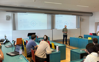 Christof Bitschnau standing in front of class, talking to students