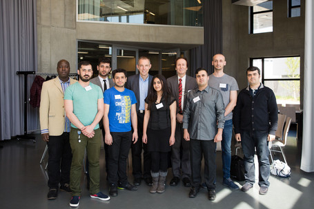 Refugee interns with Vice-Rector Michael Lang and mentor Josef Aff