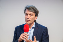 Christian Grünhaus bei der Podiumsdiskussion