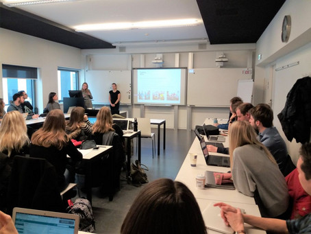 Photo of a class room with teacher and students.