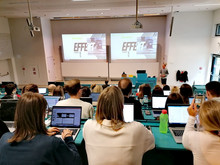 students in the auditorium, looking at Effekt footwear's presentation