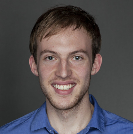 Portrait of a young man smiling.