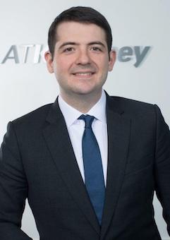 Portrait of a young man in a suit.